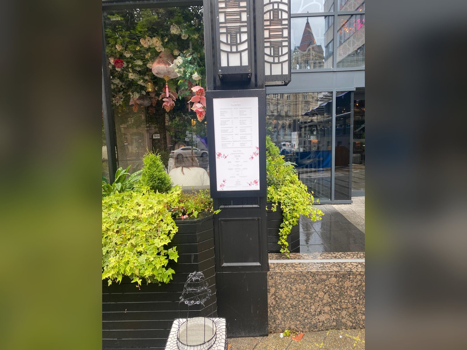 Digital menu screen built into a restaurant pillar