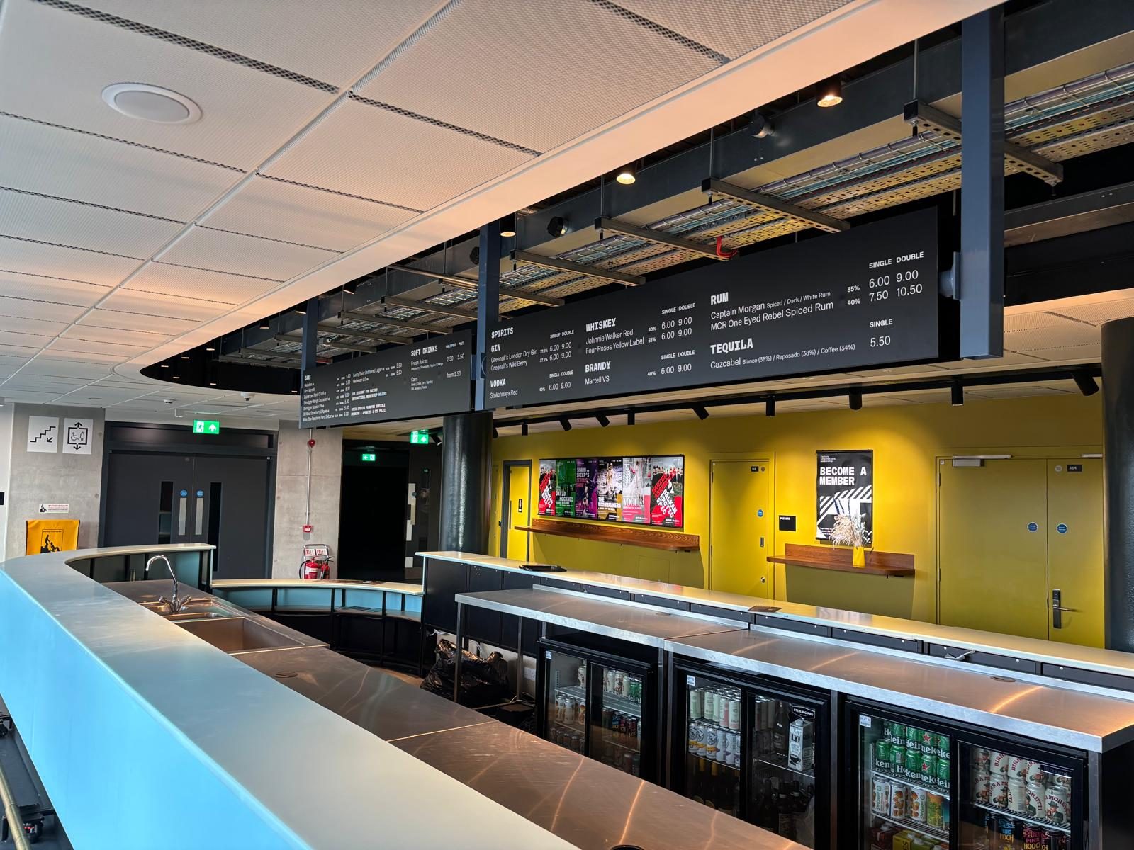 Suspended menu boards in a food hall