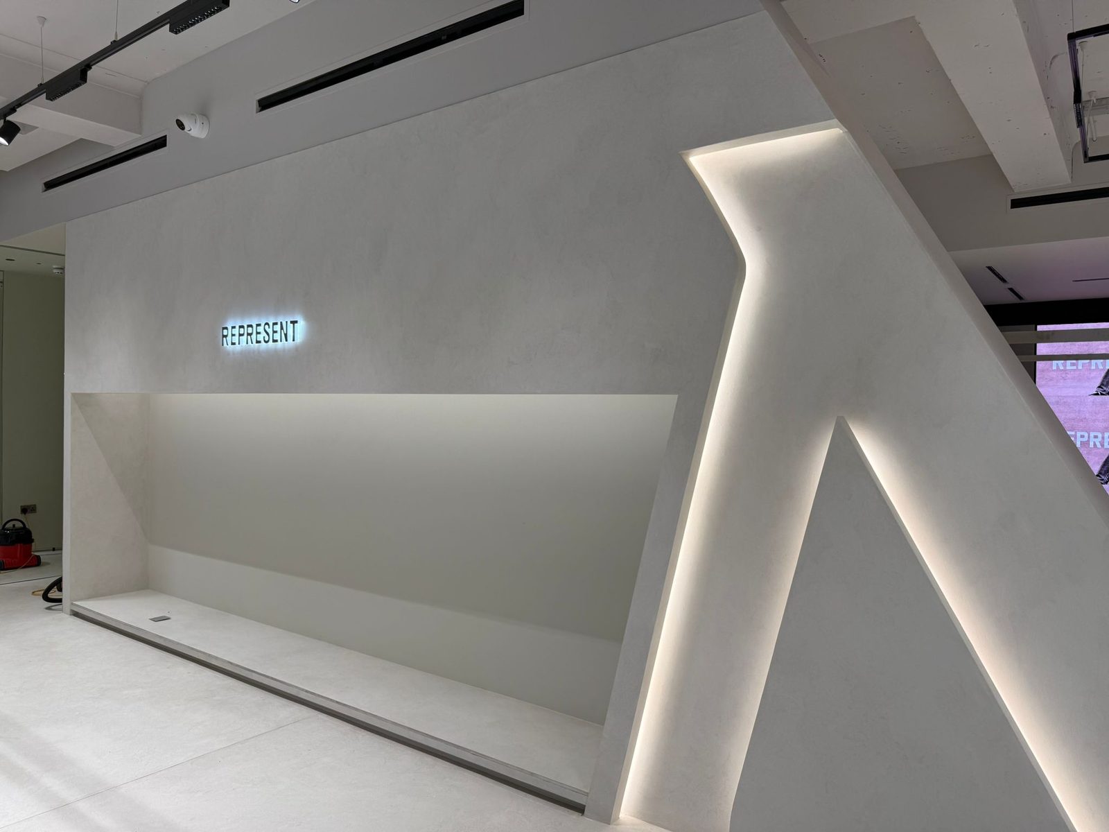 Cove lit sculptural feature wall