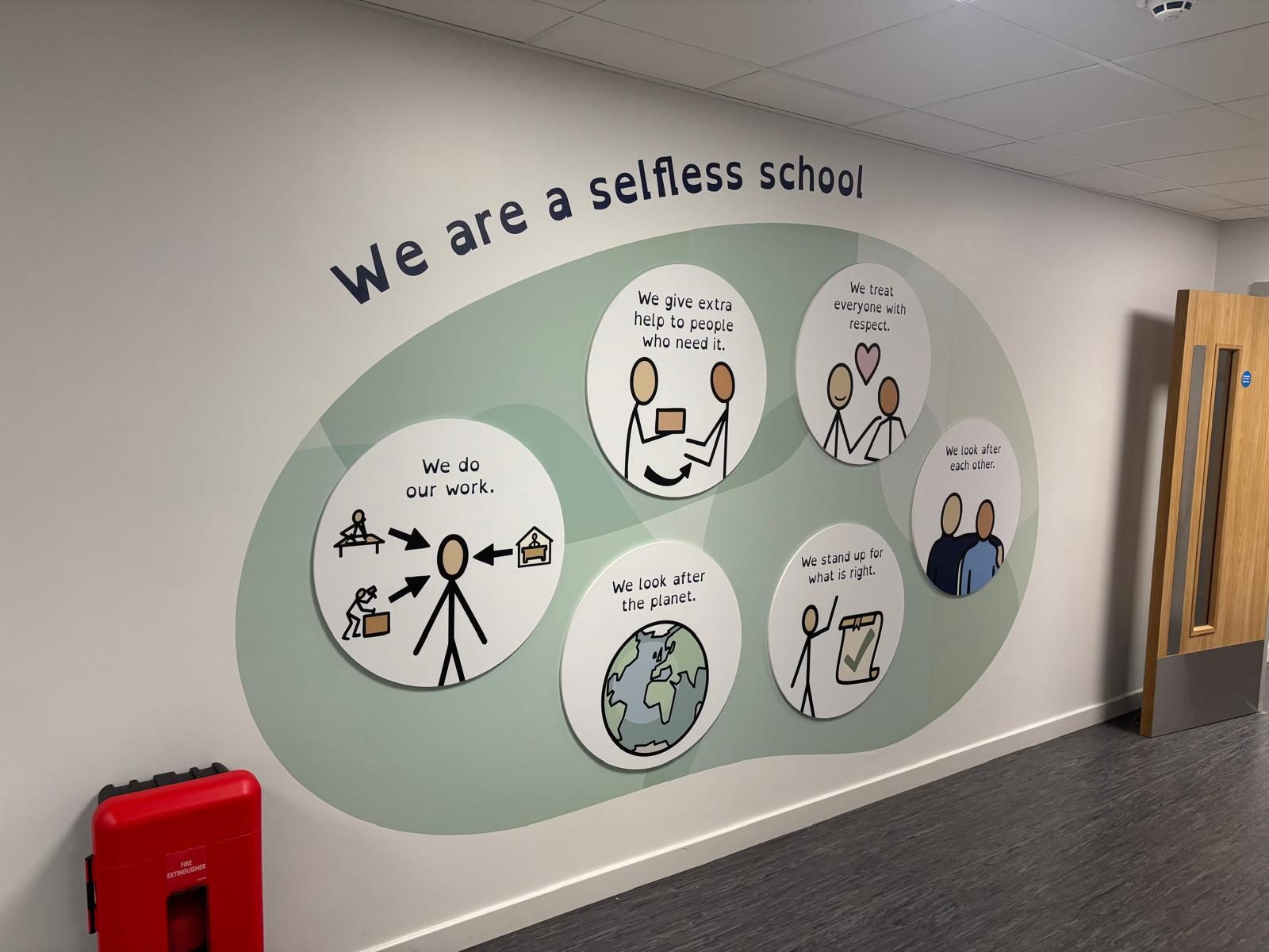 Illustrated values feature wall in a school