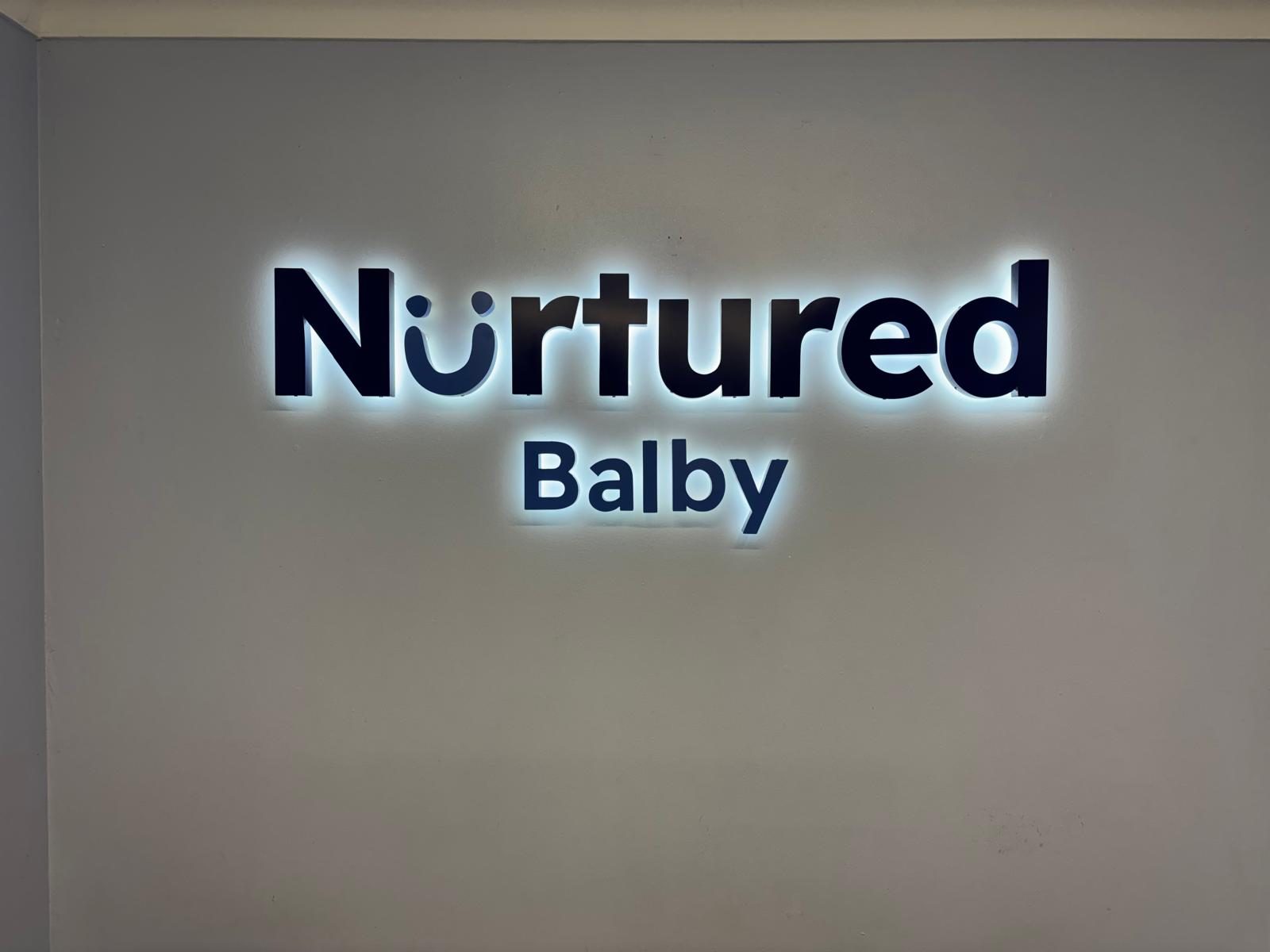 Illuminated built up letters on a nursery reception wall