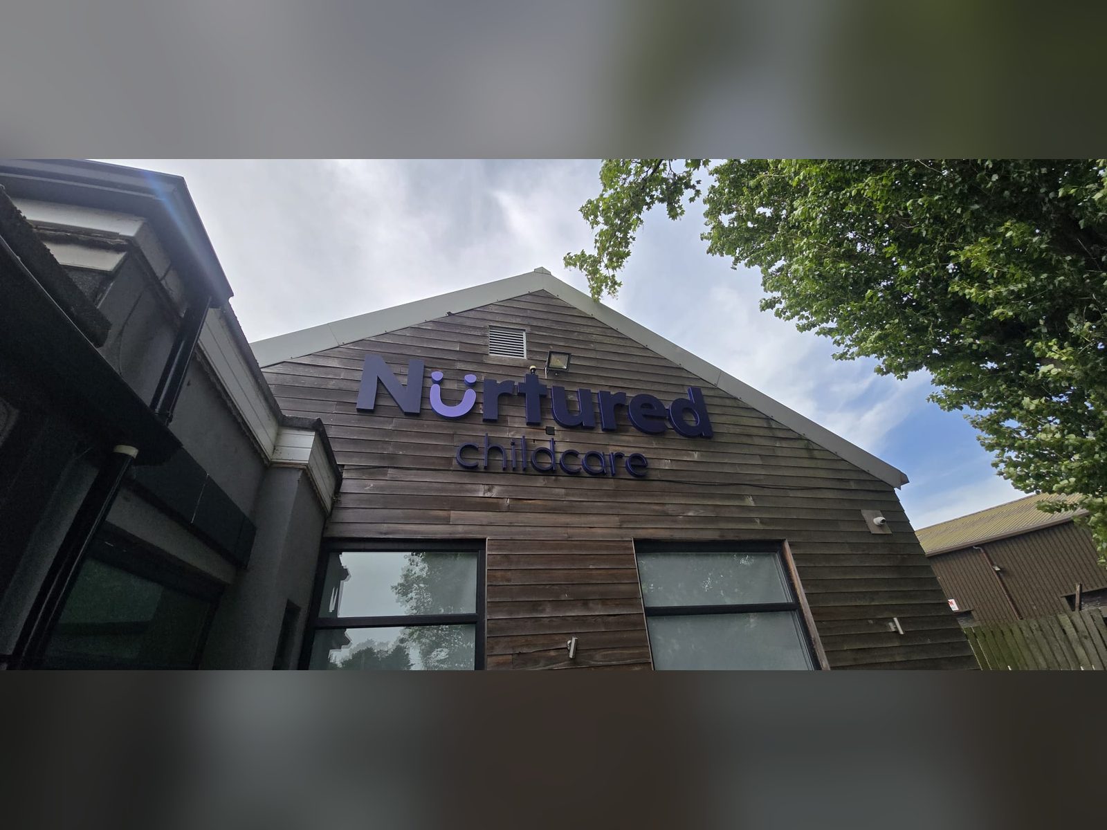Built up letters mounted on timber cladding