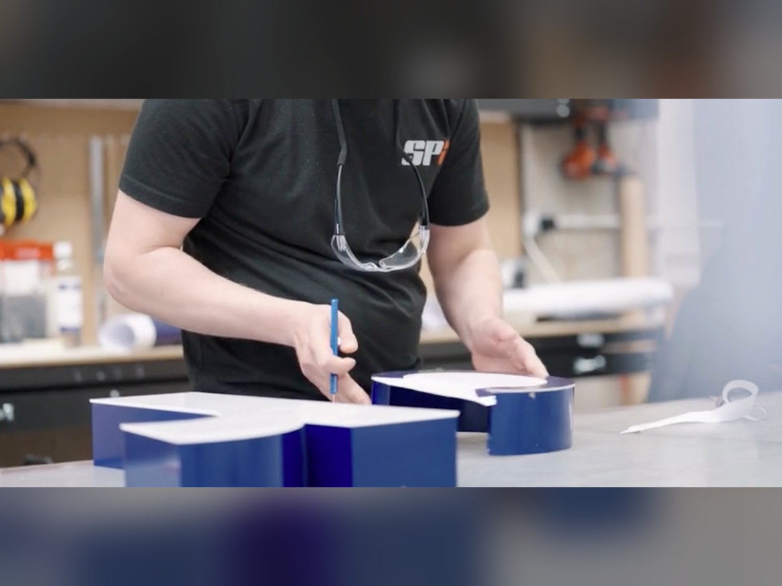 Built up letters being assembled in the SPI workshop