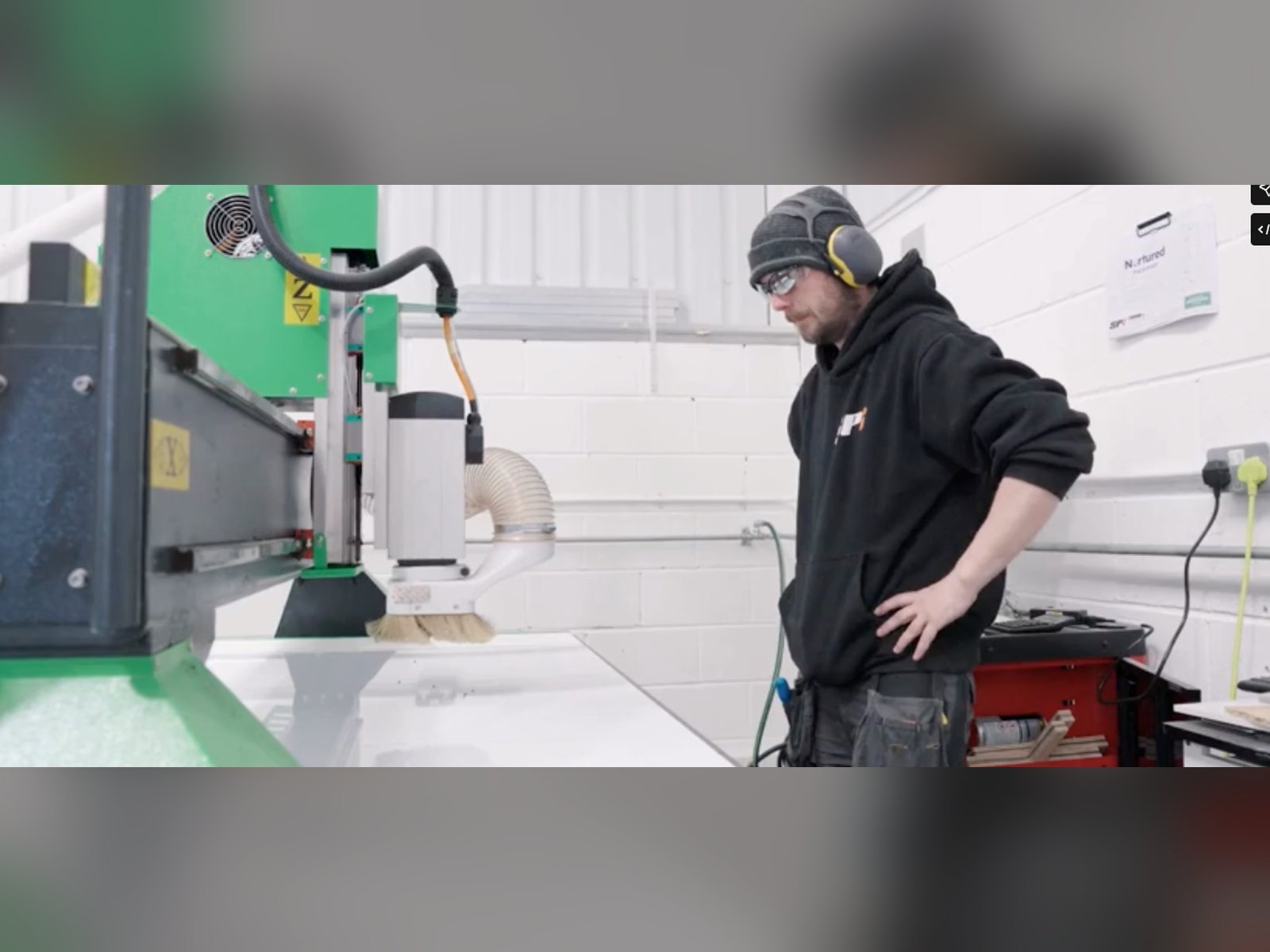 CNC router operator at work in the SPI workshop, Bolton
