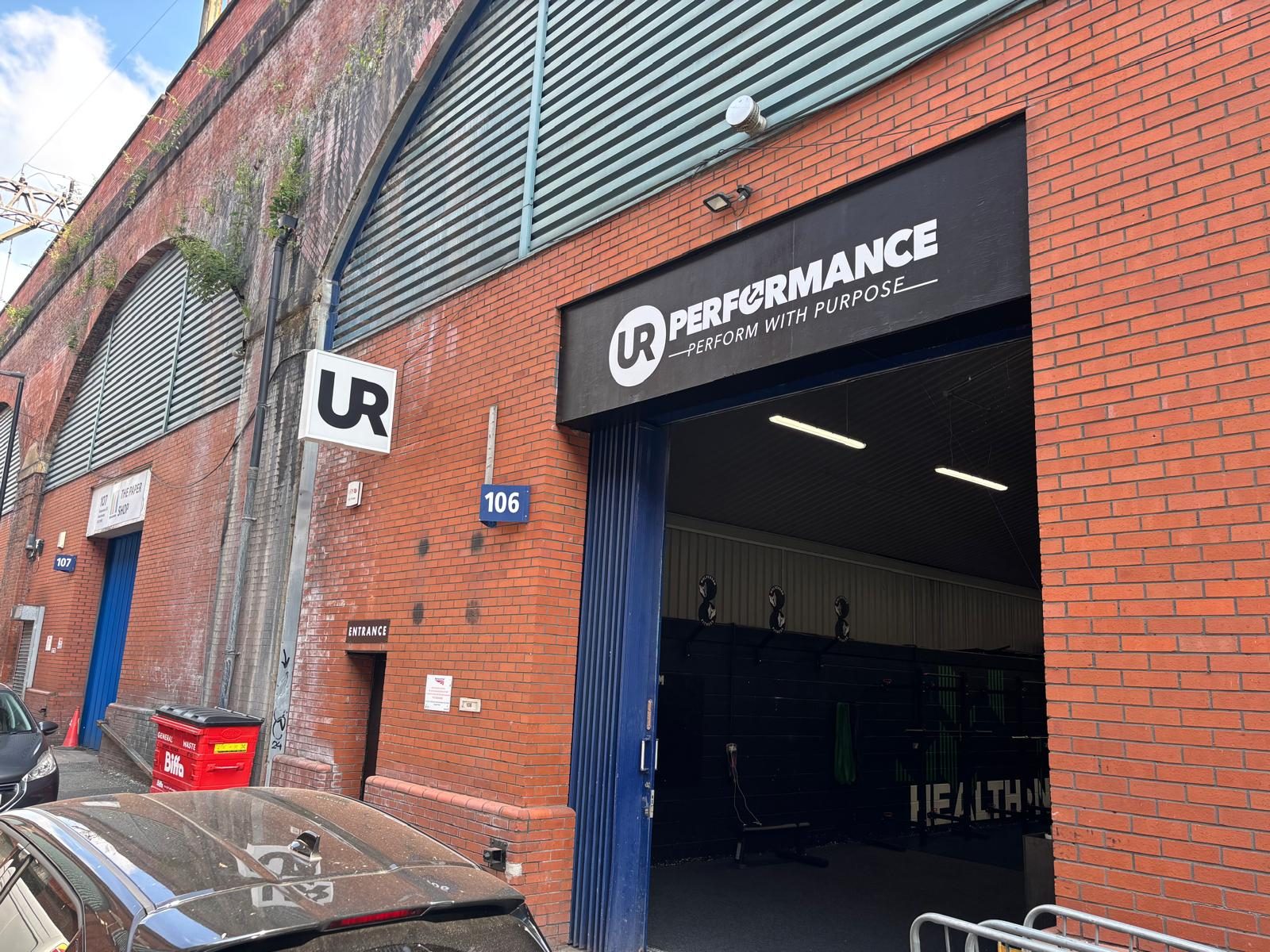 Fascia sign over a railway arch gym entrance