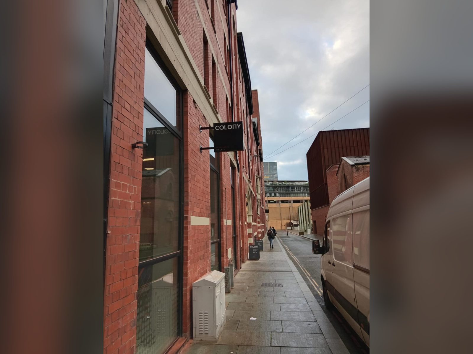 Projecting sign on a red brick building