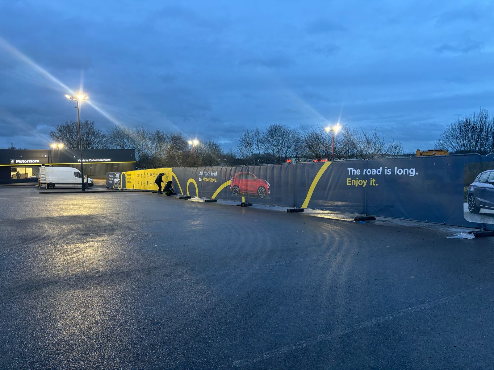 Printed Heras fence banners around a car dealership site