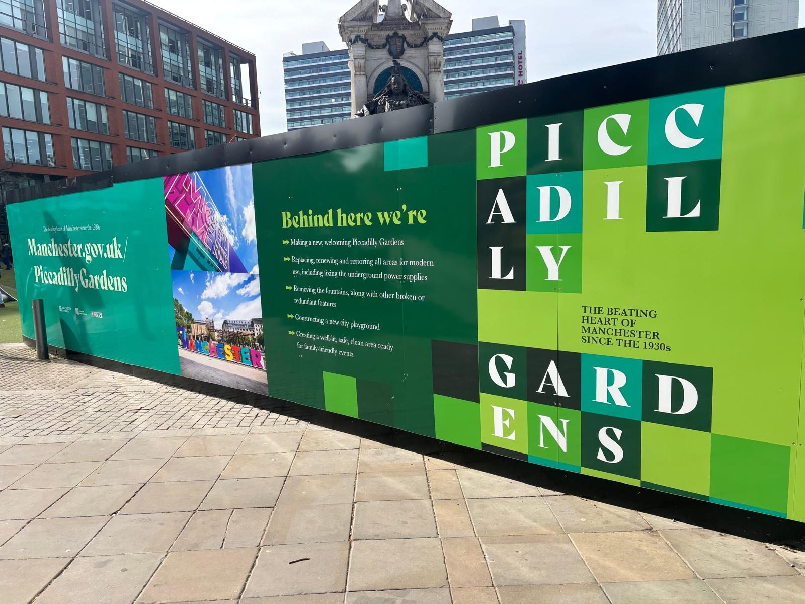 Hoarding with public information panels in Manchester city centre