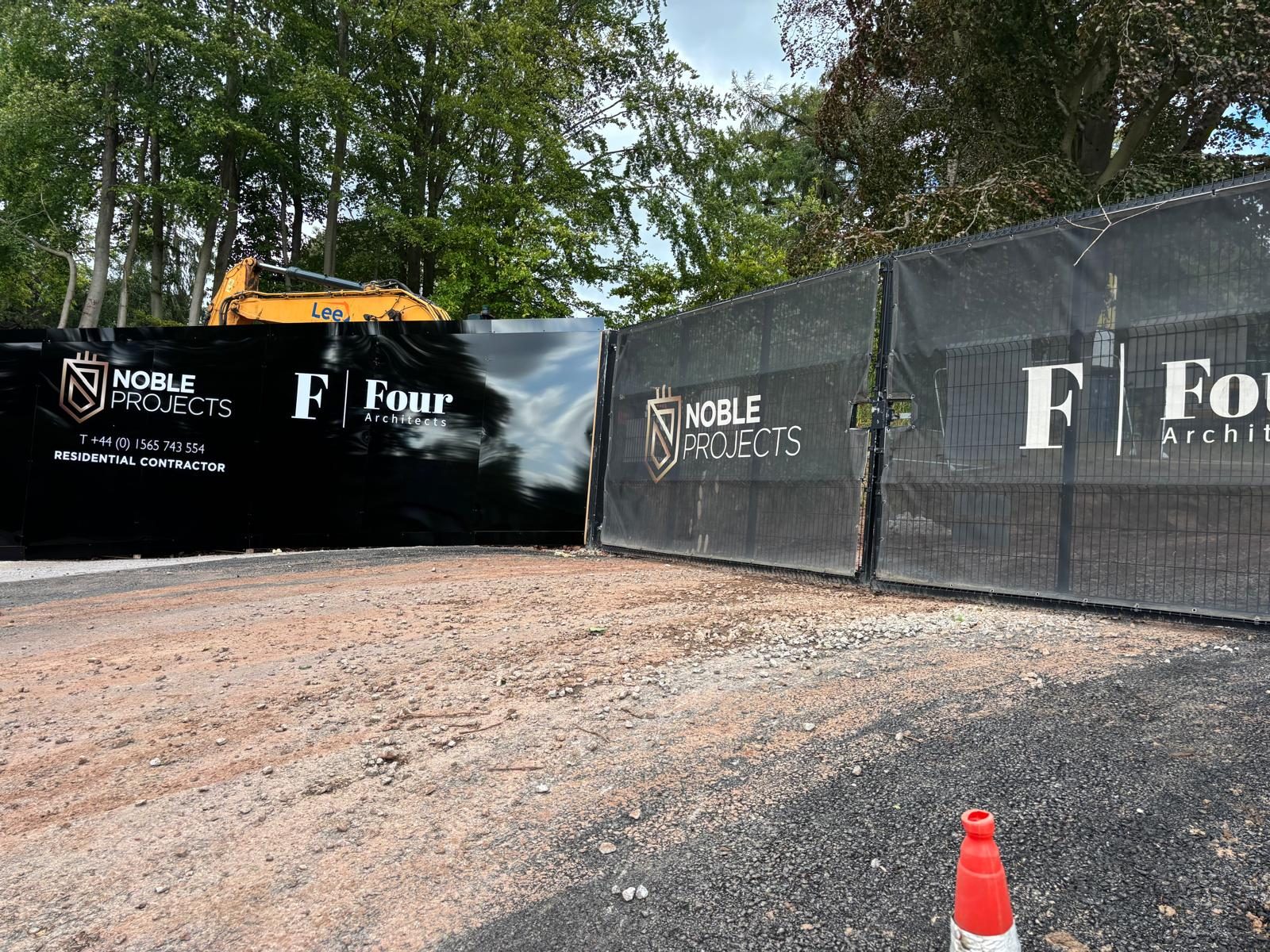 Printed mesh banners on Heras fencing around a construction site
