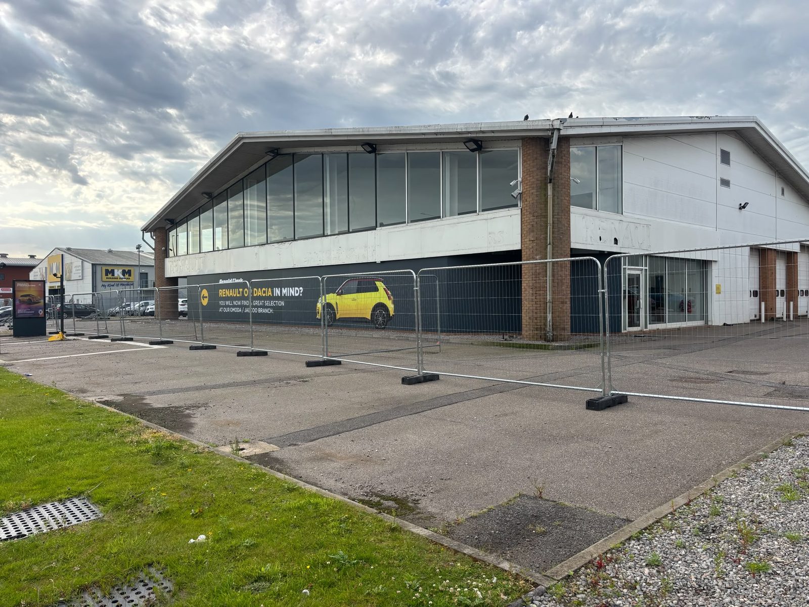 Heras fencing and hoarding around a dealership site