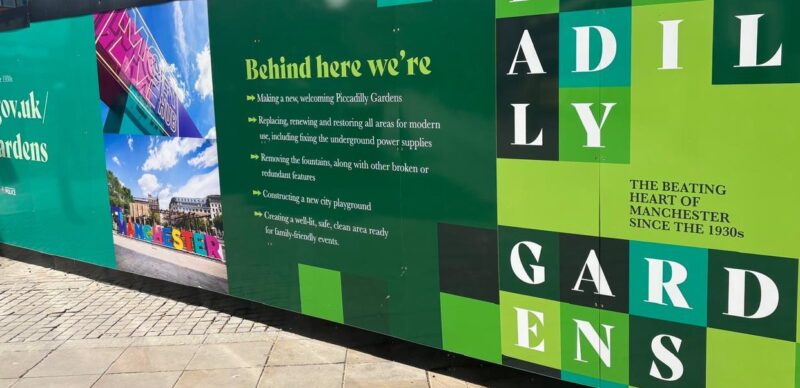Printed hoarding around Piccadilly Gardens, Manchester