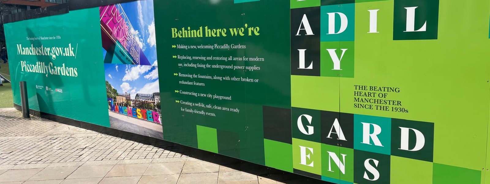 Printed hoarding around Piccadilly Gardens, Manchester