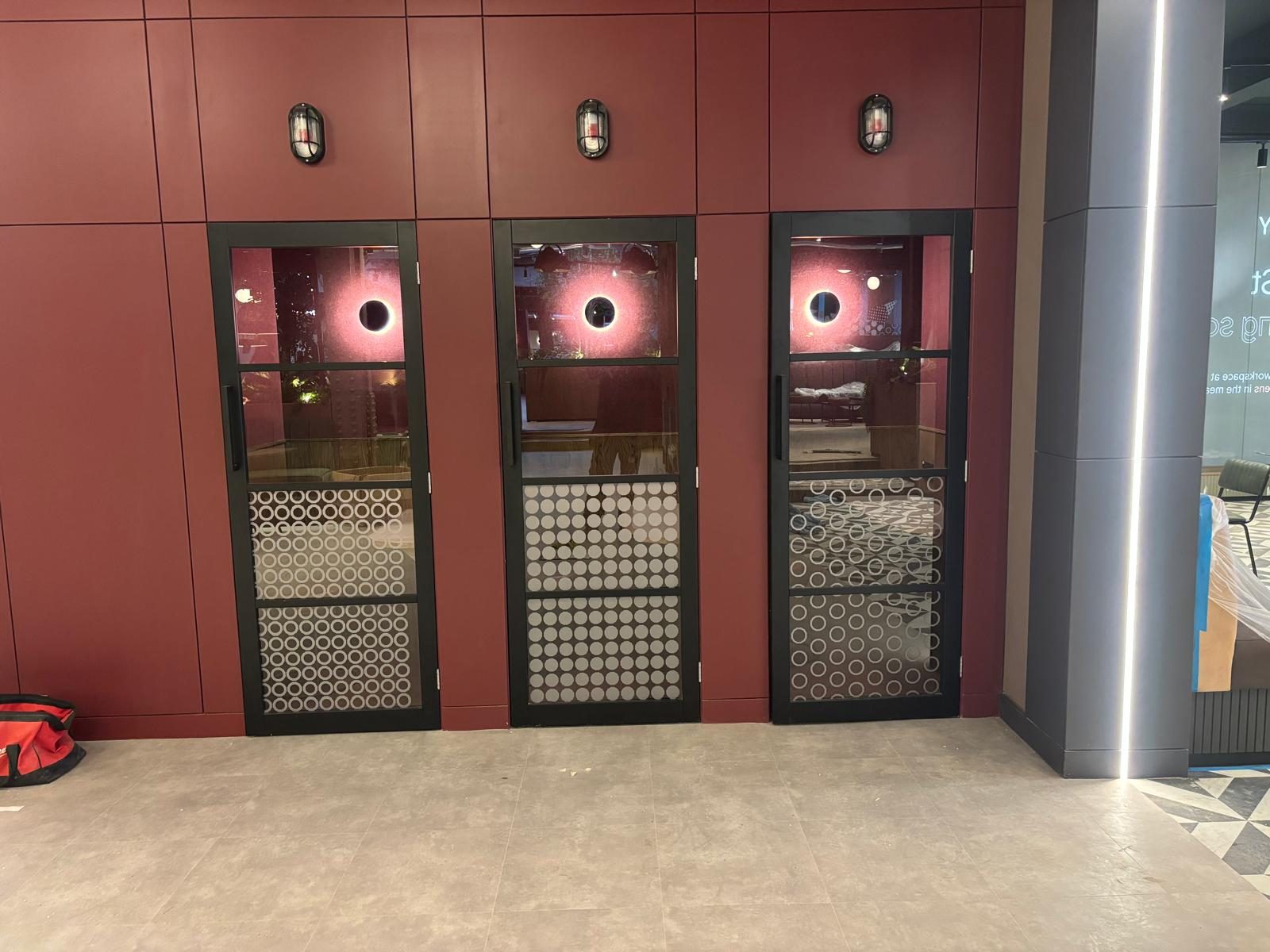 Decorative glazing manifestation on meeting room doors