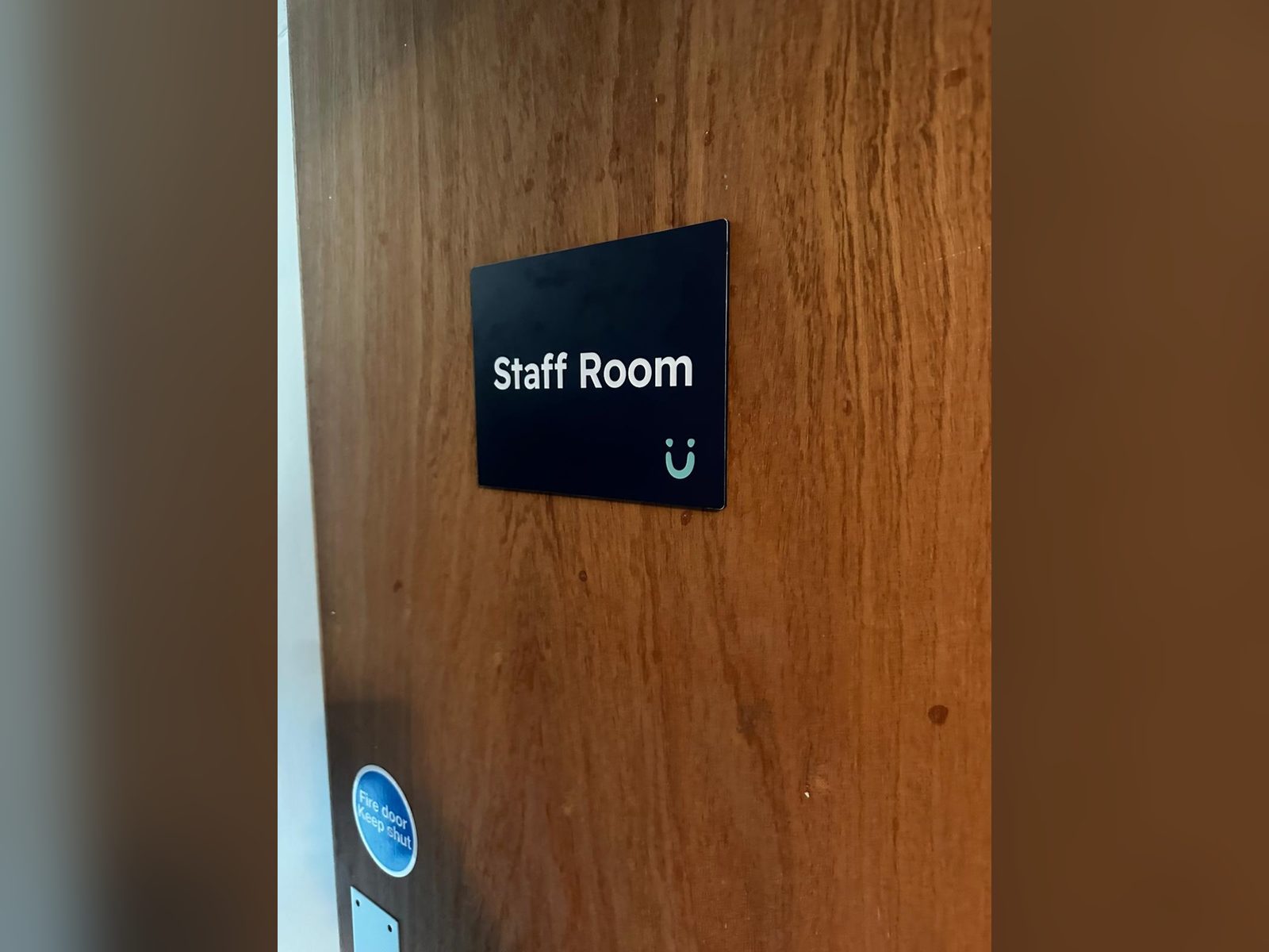 Staff room door sign in navy with white text