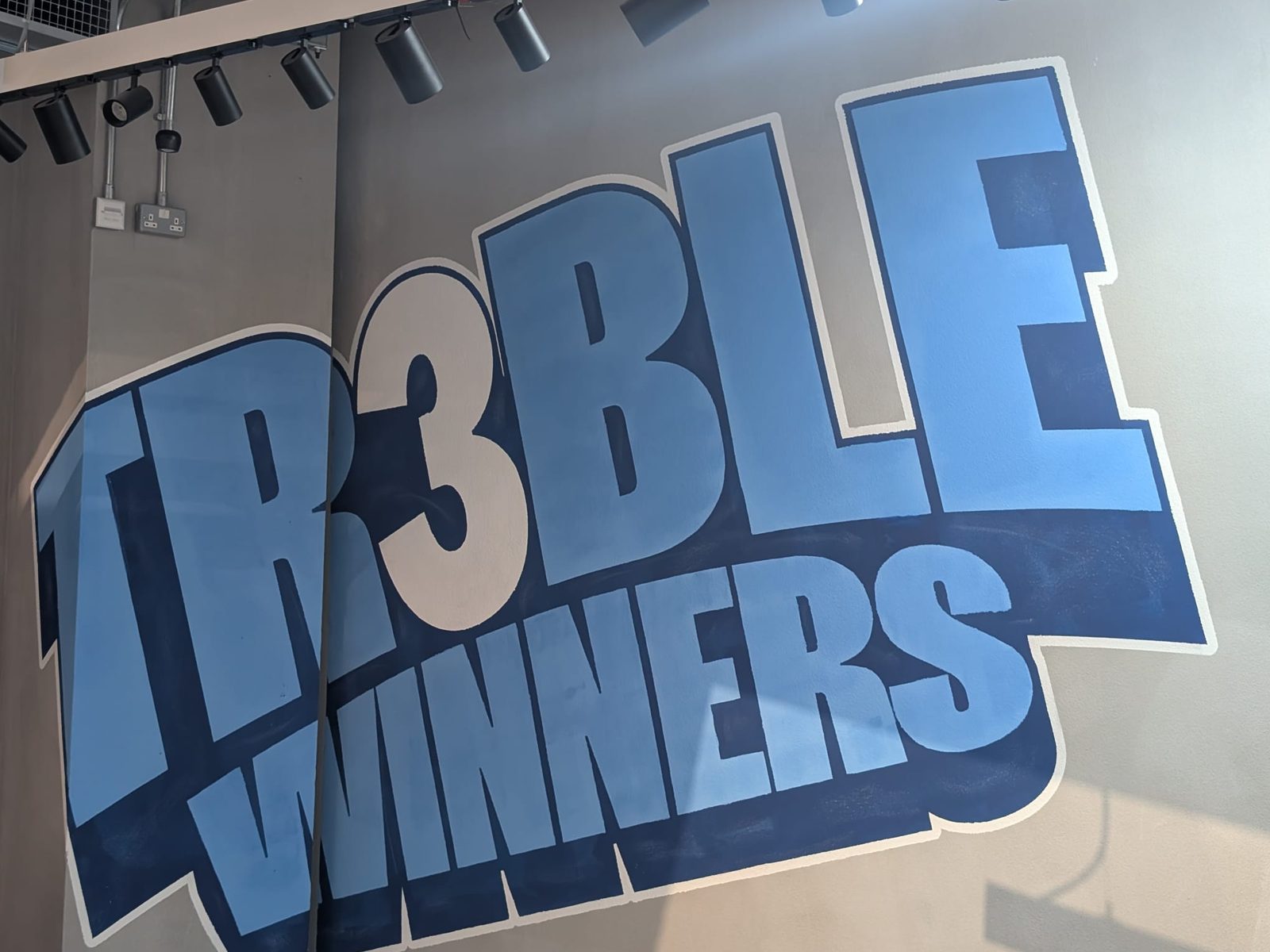 Large format wall graphic at a football venue