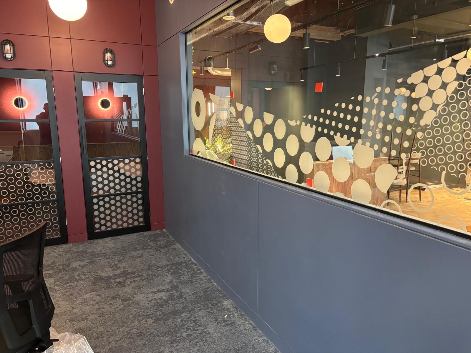 Patterned glazing manifestation on a meeting room screen