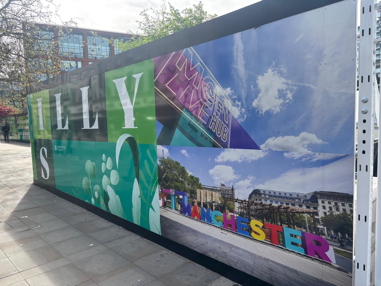 Colourful printed hoarding mural in Manchester