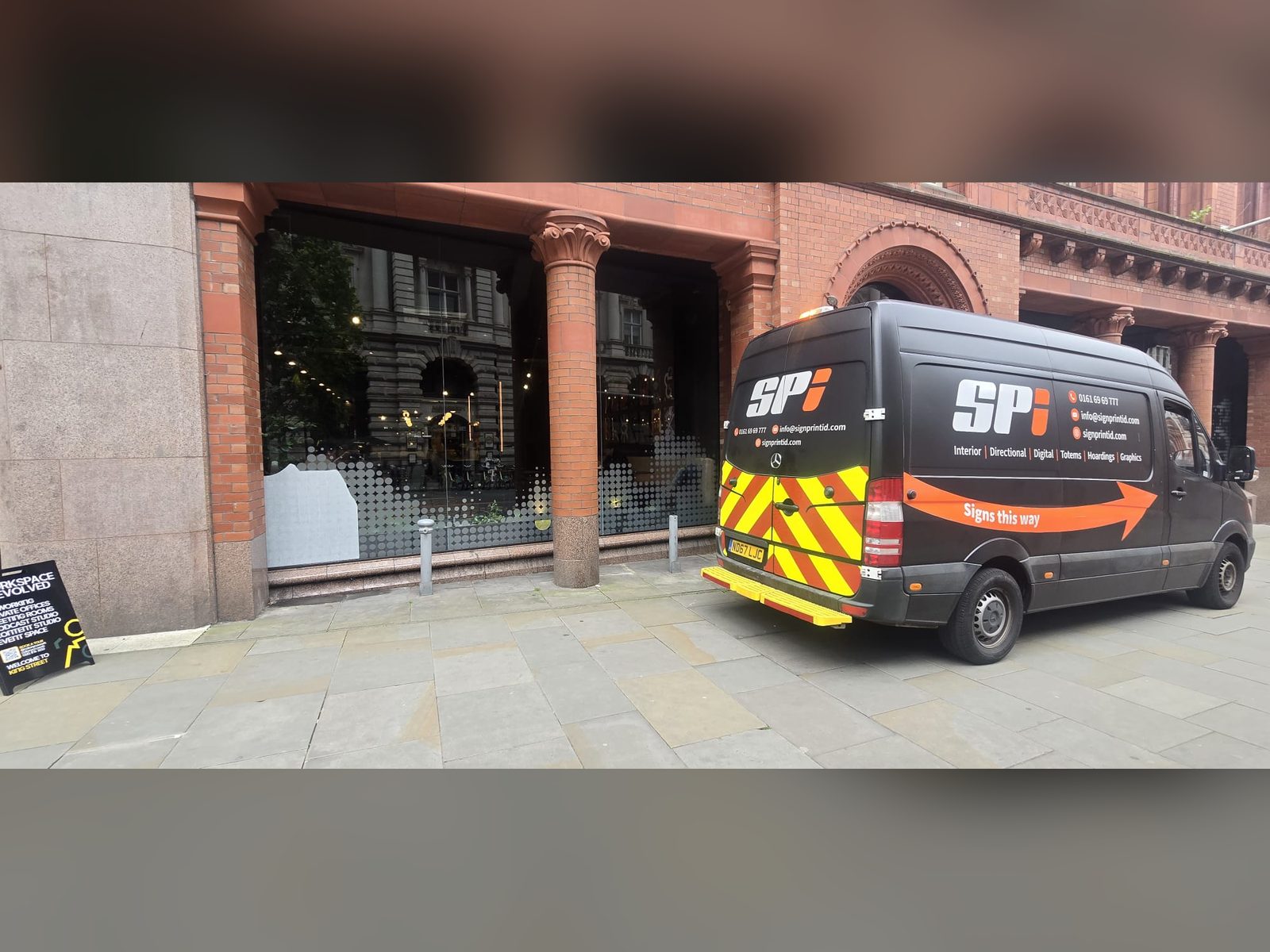 SPI van livery and frosted window graphics on a Victorian building