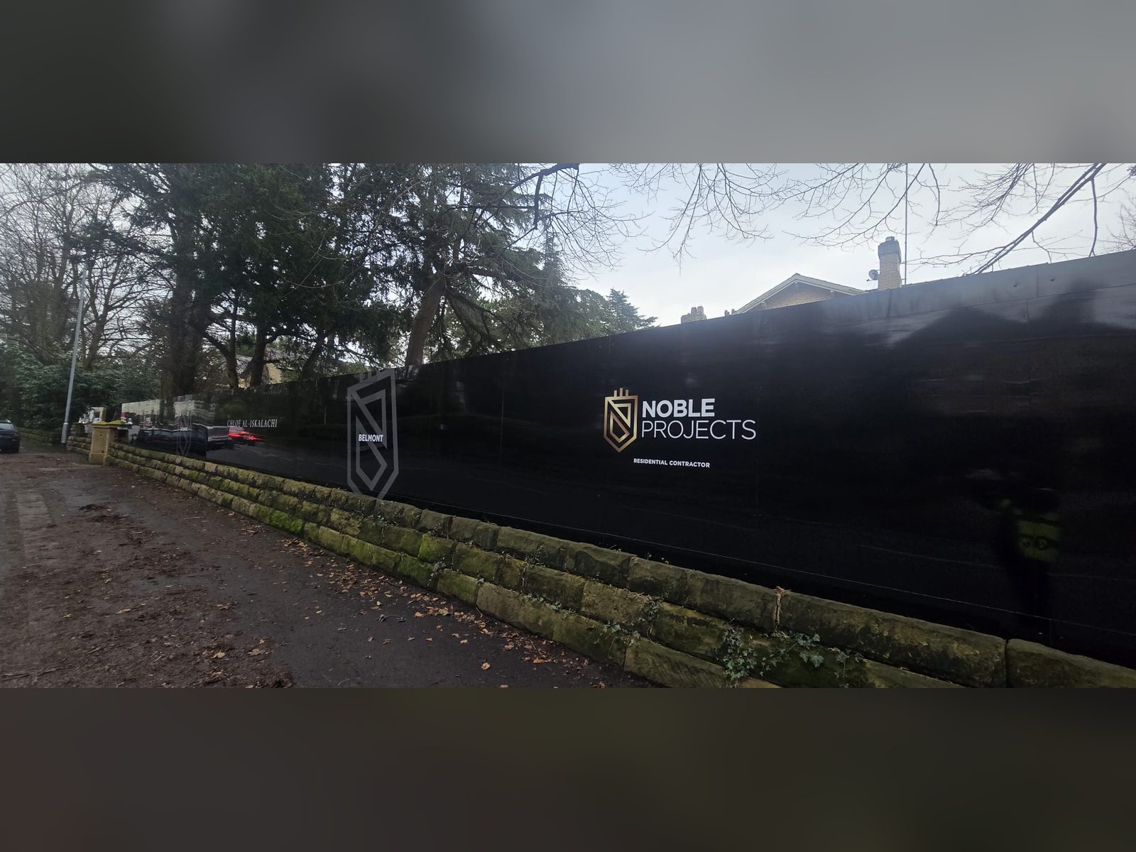 Printed branding on a construction site hoarding