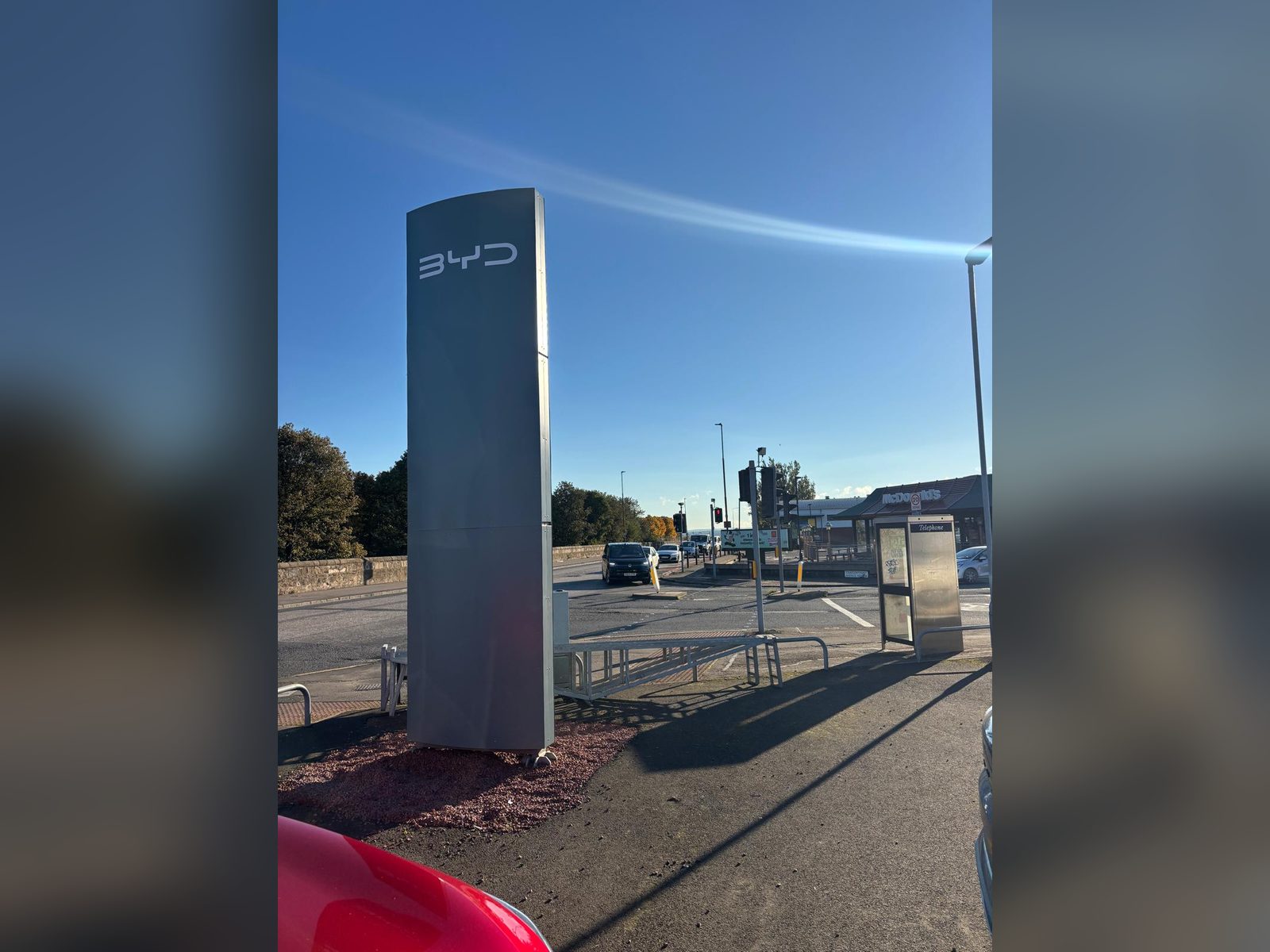 Brushed metal finish totem at a car showroom