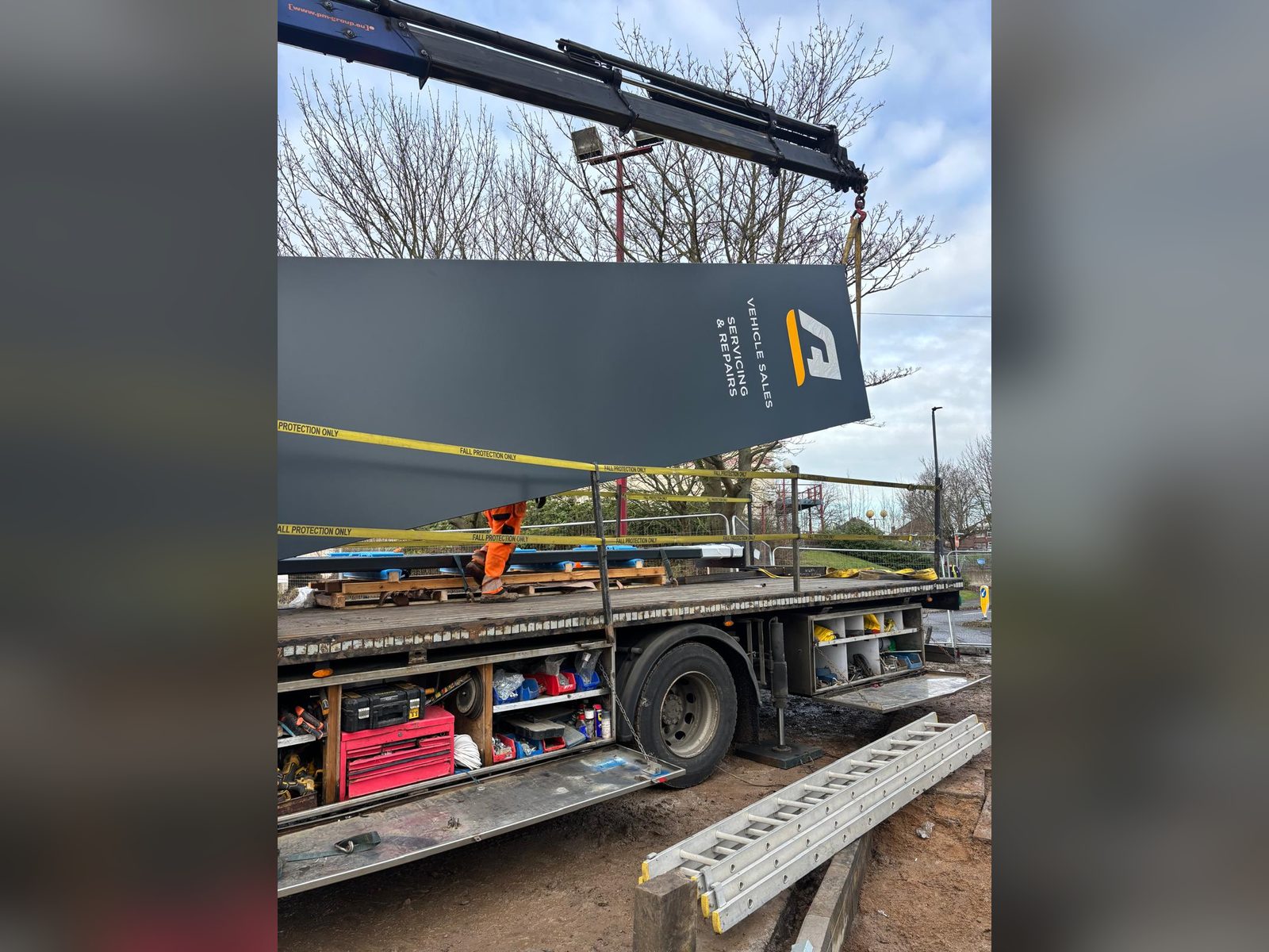 Totem structure being craned into place on site