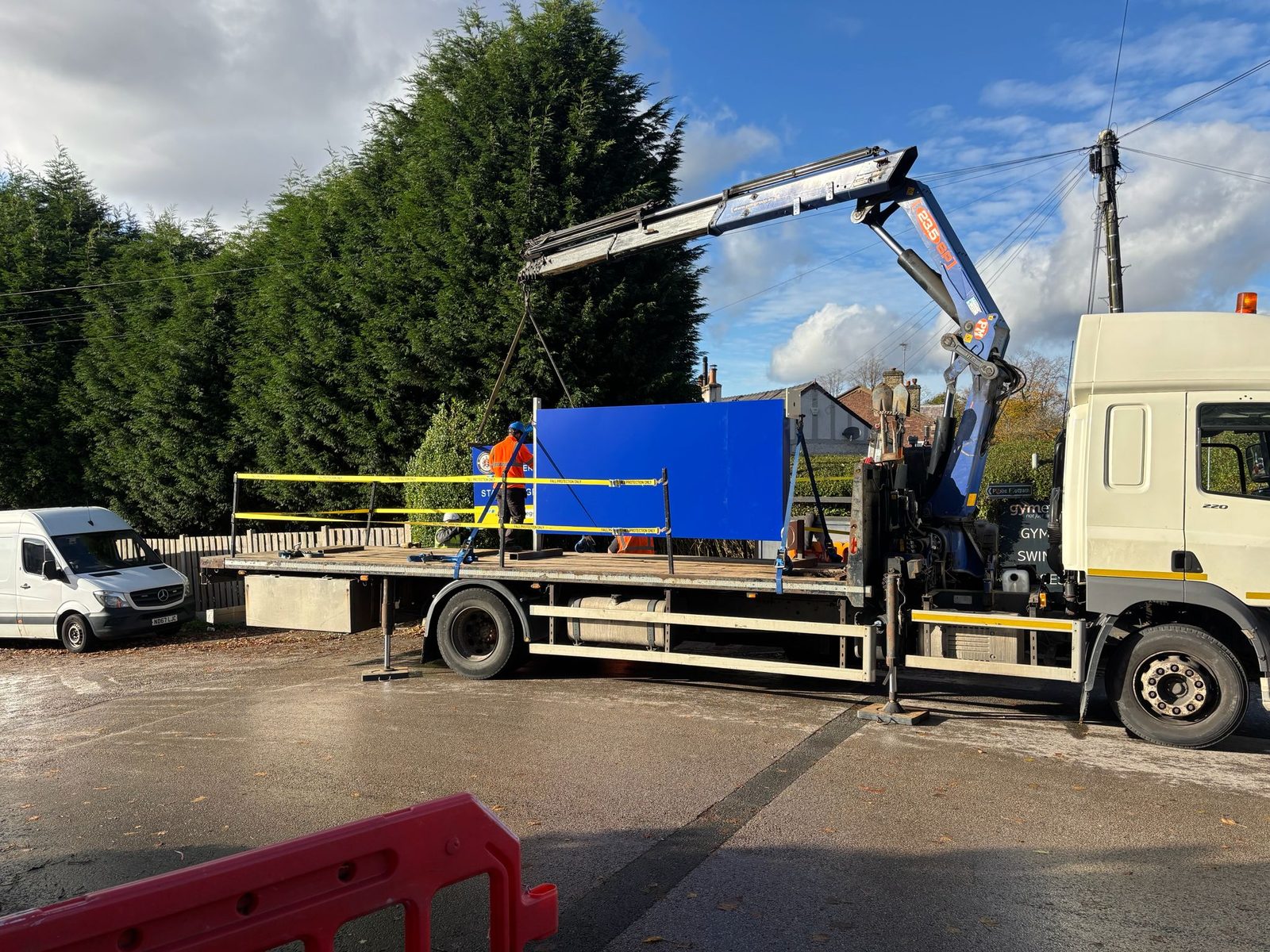 Totem panel on a crane lorry ready for installation