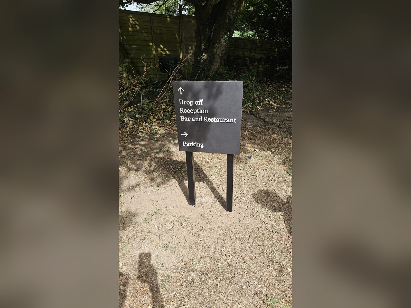 Post mounted directional sign at a hotel venue
