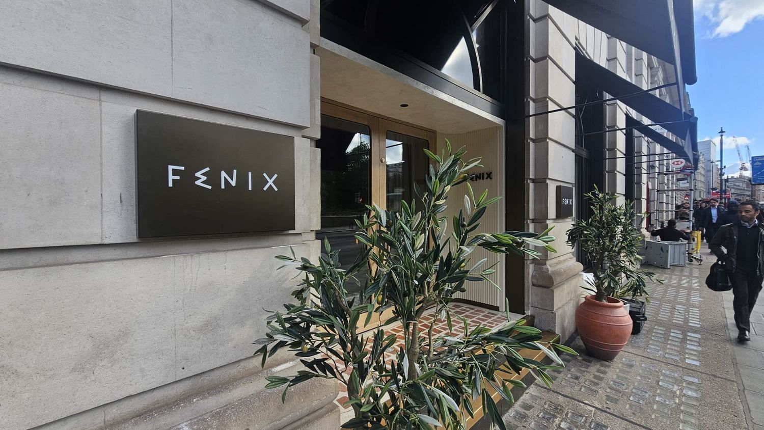 Fenix Mayfair | Bronze illuminated entrance sign Bronze illuminated FENIX entrance sign on the Portland stone facade at Fenix Mayfair