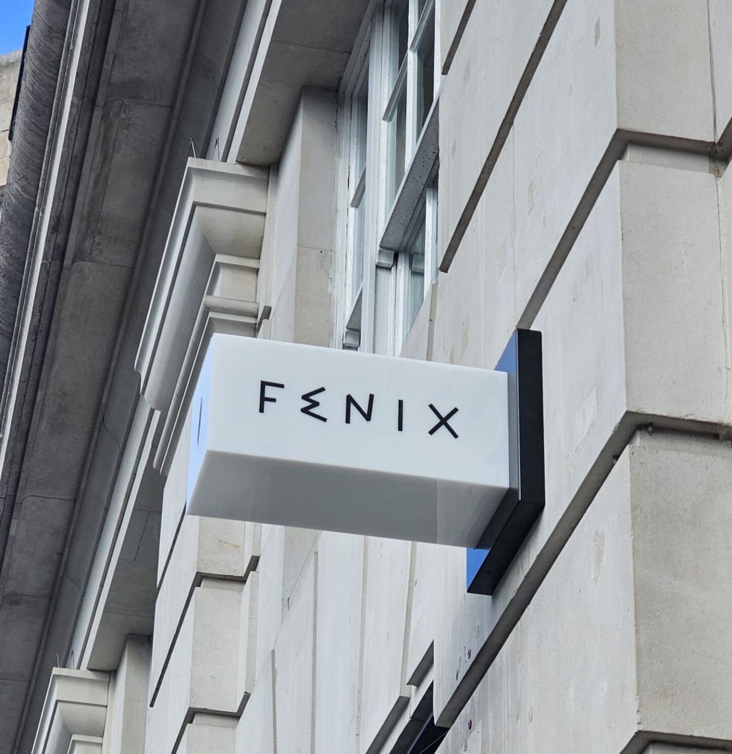 Fenix Mayfair | Illuminated projecting sign Illuminated projecting sign on the Portland stone facade at Fenix Mayfair