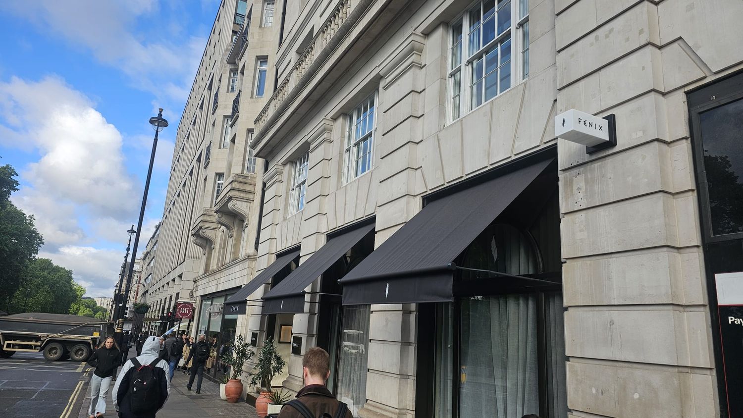 Fenix Mayfair | Shopfront and projecting sign Fenix Mayfair shopfront with illuminated projecting sign above the awnings